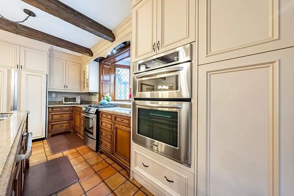 The Mississauga Castle Embraces meticulous hand crafted wood work, painted murals and exquisite stained glass windows now available for sale