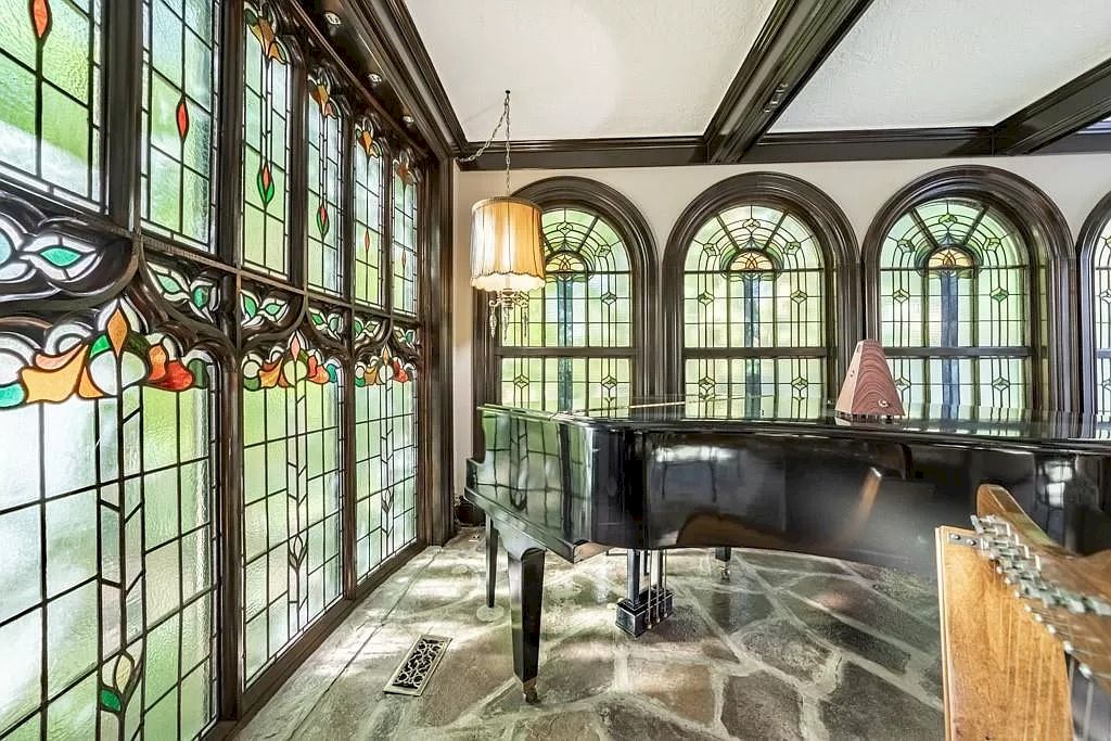 The Mississauga Castle Embraces meticulous hand crafted wood work, painted murals and exquisite stained glass windows now available for sale