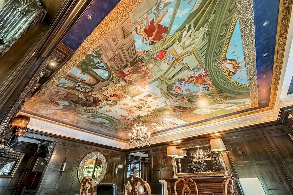 The Mississauga Castle Embraces meticulous hand crafted wood work, painted murals and exquisite stained glass windows now available for sale