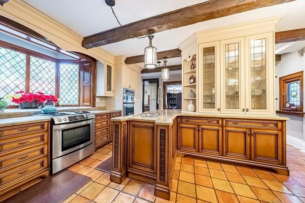The Mississauga Castle Embraces meticulous hand crafted wood work, painted murals and exquisite stained glass windows now available for sale