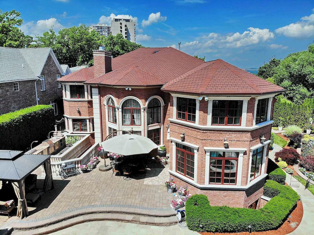 The Home in New Jersey is a luxurious home set on meticulously manicured grounds now available for sale. This home located at 2 Euclid Rd, Fort Lee, New Jersey; offering 06 bedrooms and 07 bathrooms with 6,000 square feet of living spaces. 