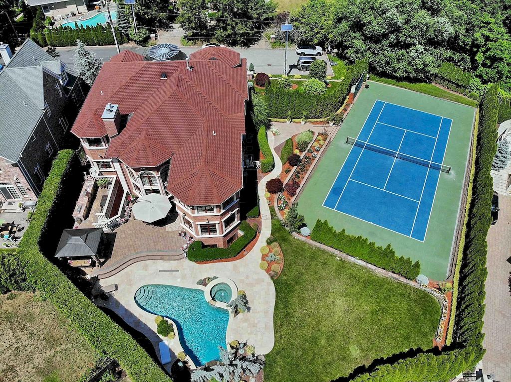 The Home in New Jersey is a luxurious home set on meticulously manicured grounds now available for sale. This home located at 2 Euclid Rd, Fort Lee, New Jersey; offering 06 bedrooms and 07 bathrooms with 6,000 square feet of living spaces. 