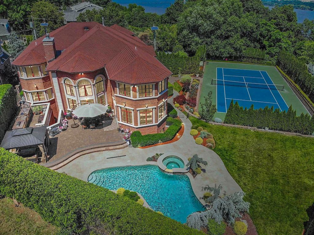 The Home in New Jersey is a luxurious home set on meticulously manicured grounds now available for sale. This home located at 2 Euclid Rd, Fort Lee, New Jersey; offering 06 bedrooms and 07 bathrooms with 6,000 square feet of living spaces. 