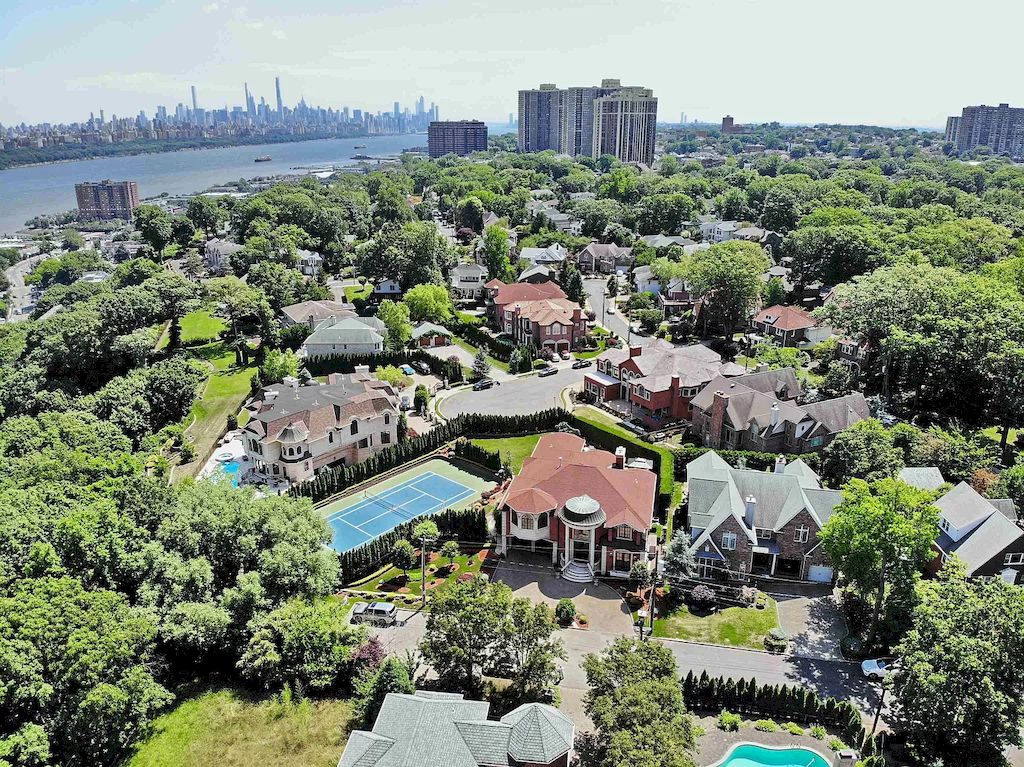 The Home in New Jersey is a luxurious home set on meticulously manicured grounds now available for sale. This home located at 2 Euclid Rd, Fort Lee, New Jersey; offering 06 bedrooms and 07 bathrooms with 6,000 square feet of living spaces. 