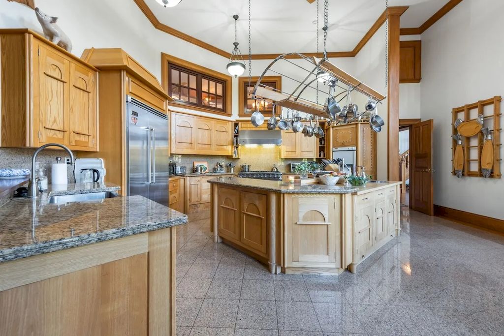 The Home in Connecticut is a luxurious home offering custom designed interiors, enchanting water views, expansive gardens, and so on now available for sale. This home located at 913 Oenoke Rdg, New Canaan, Connecticut; offering 07 bedrooms and 09 bathrooms with 10,824 square feet of living spaces.