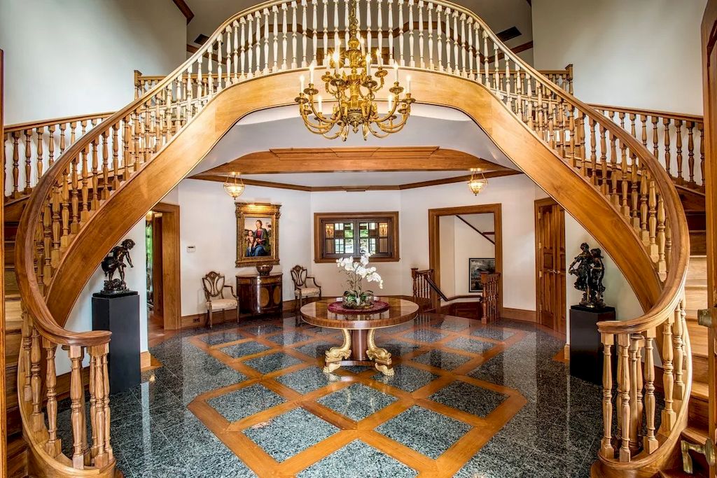 The Home in Connecticut is a luxurious home offering custom designed interiors, enchanting water views, expansive gardens, and so on now available for sale. This home located at 913 Oenoke Rdg, New Canaan, Connecticut; offering 07 bedrooms and 09 bathrooms with 10,824 square feet of living spaces.