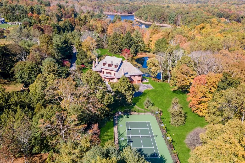 The Home in Connecticut is a luxurious home offering custom designed interiors, enchanting water views, expansive gardens, and so on now available for sale. This home located at 913 Oenoke Rdg, New Canaan, Connecticut; offering 07 bedrooms and 09 bathrooms with 10,824 square feet of living spaces.