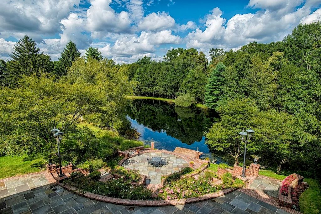 The Home in Connecticut is a luxurious home offering custom designed interiors, enchanting water views, expansive gardens, and so on now available for sale. This home located at 913 Oenoke Rdg, New Canaan, Connecticut; offering 07 bedrooms and 09 bathrooms with 10,824 square feet of living spaces.