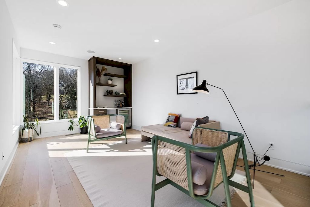 Green is the natural color of the earth, so it's no surprise that designers pair it with earth tones. Furthermore, by using natural materials like wood or sedge, the combination of these color tones will bring calmness to the living room. Aside from the idea of a giant couch, the idea of monochromatic living rooms includes selecting a couch that is a variation of a chair. Against the white painted background, a modern tree lamp and simple modern furniture in century wood make the room look beautiful.