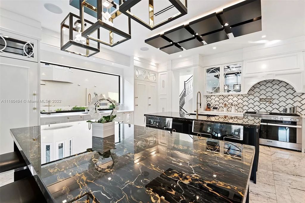 The Mansion in Fort Lauderdale is a timelessly designed home featuring a grand double height entryway and a thoughtful floorplan now available for sale. This home located at 2436 Aqua Vista Blvd, Fort Lauderdale, Florida