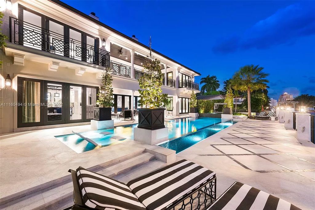 The Mansion in Fort Lauderdale is a timelessly designed home featuring a grand double height entryway and a thoughtful floorplan now available for sale. This home located at 2436 Aqua Vista Blvd, Fort Lauderdale, Florida