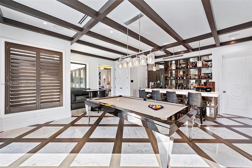 The Mansion in Fort Lauderdale is a timelessly designed home featuring a grand double height entryway and a thoughtful floorplan now available for sale. This home located at 2436 Aqua Vista Blvd, Fort Lauderdale, Florida