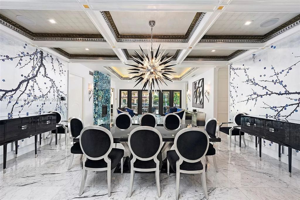 The Mansion in Fort Lauderdale is a timelessly designed home featuring a grand double height entryway and a thoughtful floorplan now available for sale. This home located at 2436 Aqua Vista Blvd, Fort Lauderdale, Florida