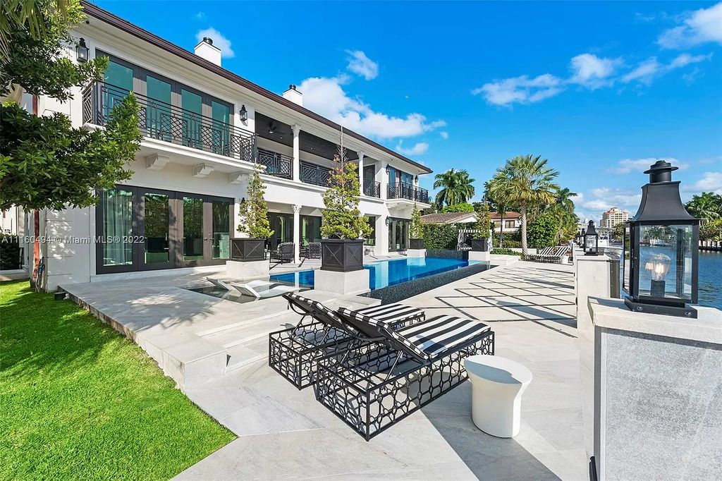 The Mansion in Fort Lauderdale is a timelessly designed home featuring a grand double height entryway and a thoughtful floorplan now available for sale. This home located at 2436 Aqua Vista Blvd, Fort Lauderdale, Florida