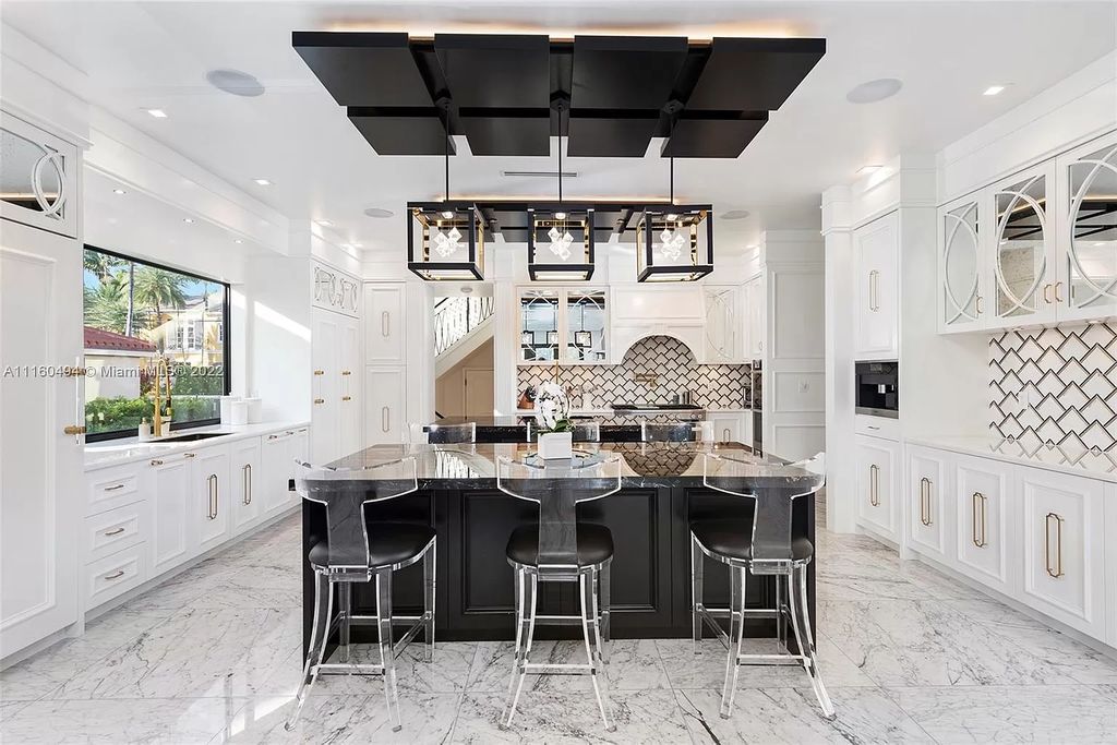 The Mansion in Fort Lauderdale is a timelessly designed home featuring a grand double height entryway and a thoughtful floorplan now available for sale. This home located at 2436 Aqua Vista Blvd, Fort Lauderdale, Florida