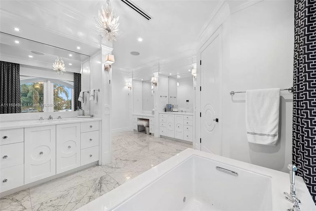 The Mansion in Fort Lauderdale is a timelessly designed home featuring a grand double height entryway and a thoughtful floorplan now available for sale. This home located at 2436 Aqua Vista Blvd, Fort Lauderdale, Florida