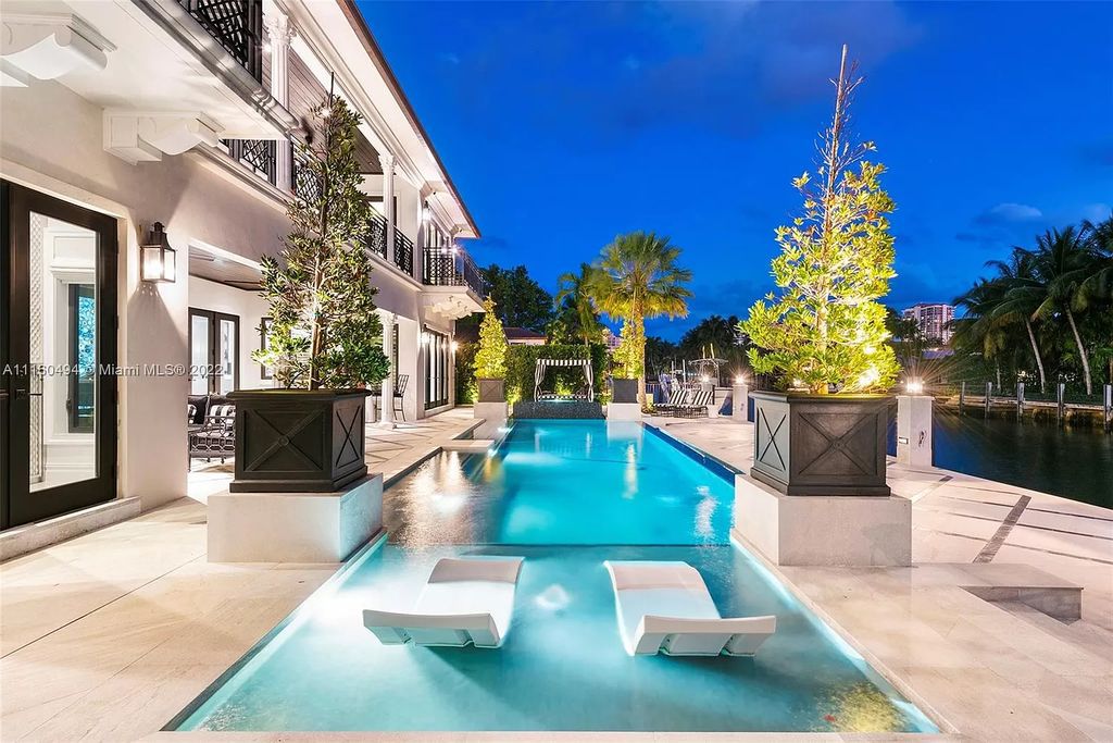 The Mansion in Fort Lauderdale is a timelessly designed home featuring a grand double height entryway and a thoughtful floorplan now available for sale. This home located at 2436 Aqua Vista Blvd, Fort Lauderdale, Florida