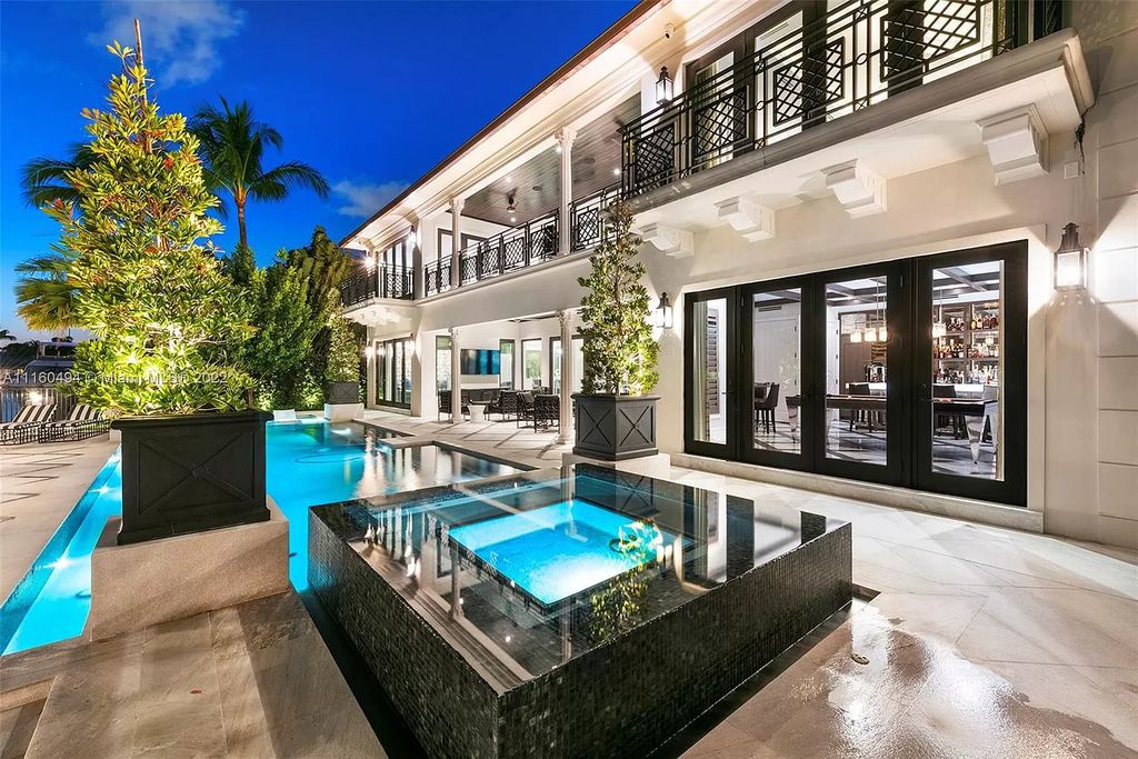 The Mansion in Fort Lauderdale is a timelessly designed home featuring a grand double height entryway and a thoughtful floorplan now available for sale. This home located at 2436 Aqua Vista Blvd, Fort Lauderdale, Florida