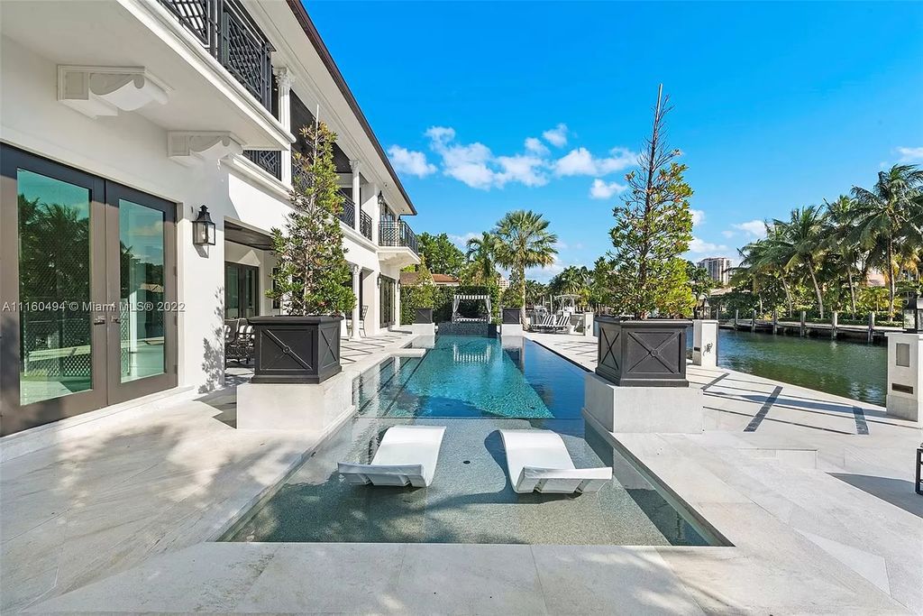 The Mansion in Fort Lauderdale is a timelessly designed home featuring a grand double height entryway and a thoughtful floorplan now available for sale. This home located at 2436 Aqua Vista Blvd, Fort Lauderdale, Florida
