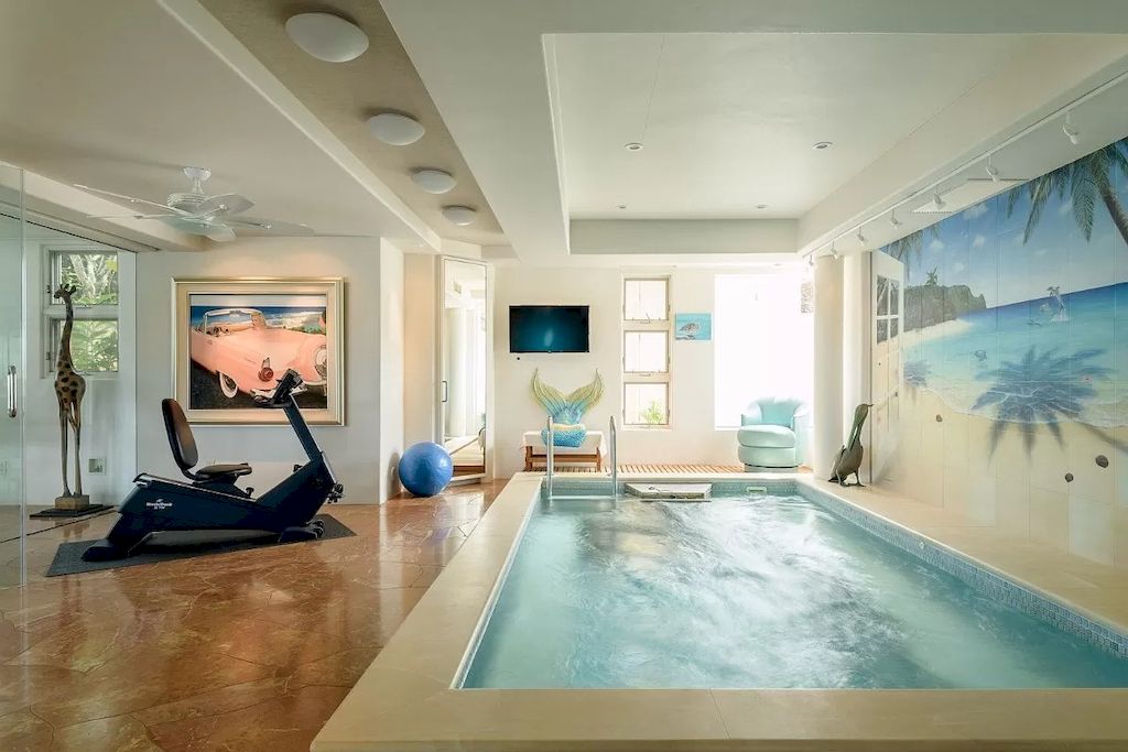 The Home in Hawaii is a luxurious home fully equipped with high-end amenities as well as commanding panoramic ocean views now available for sale.