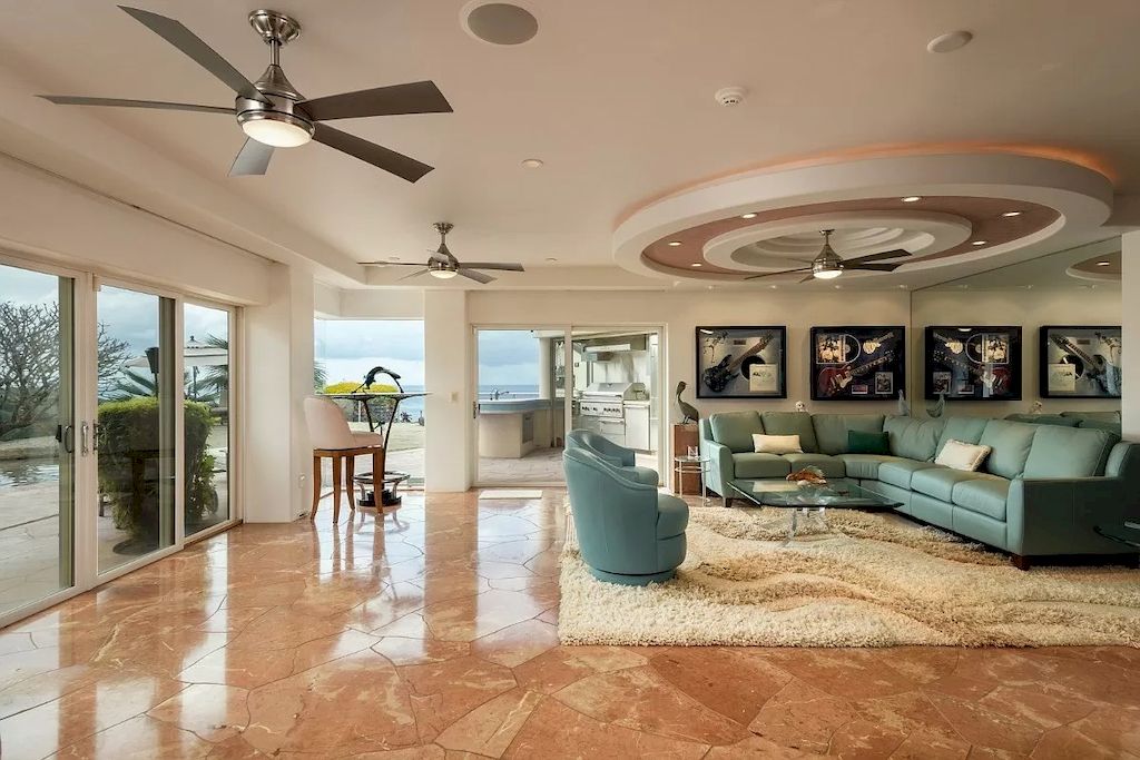 The Home in Hawaii is a luxurious home fully equipped with high-end amenities as well as commanding panoramic ocean views now available for sale.