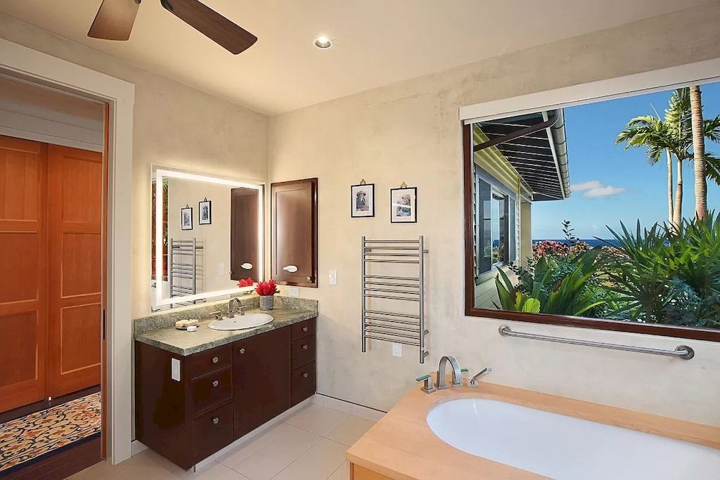 The Home in Hawaii is a luxurious home displaying unparalleled ocean, mountain, and coastal vistas now available for sale. This home located at 3027 Kalahiki St, Koloa, Hawaii; offering 04 bedrooms and 05 bathrooms with 4,490 square feet of living spaces.