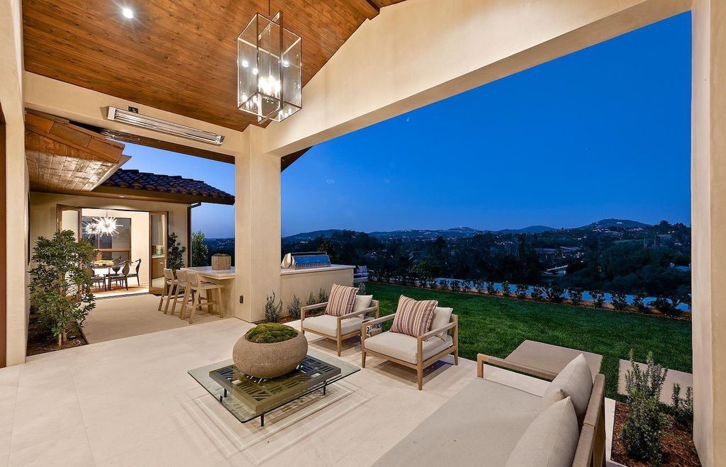 The Home in Rancho Santa Fe is an exquisite luxury oasis conceived by top team builder & design visionaries offering incomparable unobstructed views now available for sale. This house located at 18080 Via De Fortuna, Rancho Santa Fe, California