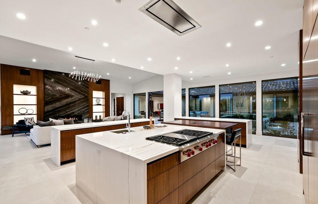 The Home in Rancho Santa Fe is an exquisite luxury oasis conceived by top team builder & design visionaries offering incomparable unobstructed views now available for sale. This house located at 18080 Via De Fortuna, Rancho Santa Fe, California