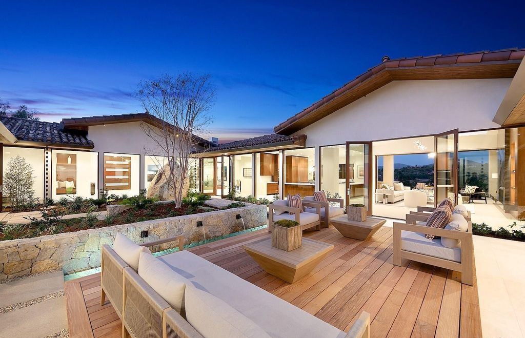 The Home in Rancho Santa Fe is an exquisite luxury oasis conceived by top team builder & design visionaries offering incomparable unobstructed views now available for sale. This house located at 18080 Via De Fortuna, Rancho Santa Fe, California