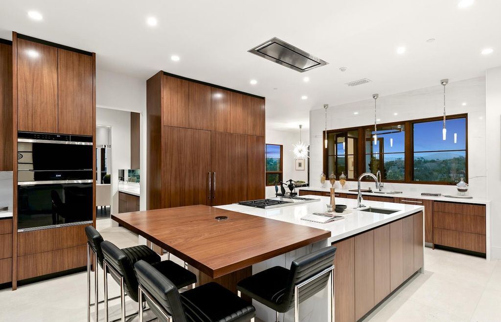 The Home in Rancho Santa Fe is an exquisite luxury oasis conceived by top team builder & design visionaries offering incomparable unobstructed views now available for sale. This house located at 18080 Via De Fortuna, Rancho Santa Fe, California