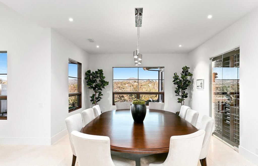The Home in Rancho Santa Fe is an exquisite luxury oasis conceived by top team builder & design visionaries offering incomparable unobstructed views now available for sale. This house located at 18080 Via De Fortuna, Rancho Santa Fe, California