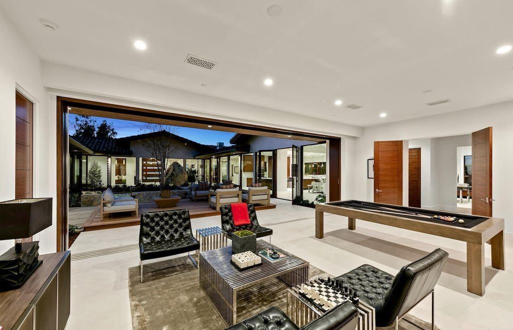 The Home in Rancho Santa Fe is an exquisite luxury oasis conceived by top team builder & design visionaries offering incomparable unobstructed views now available for sale. This house located at 18080 Via De Fortuna, Rancho Santa Fe, California