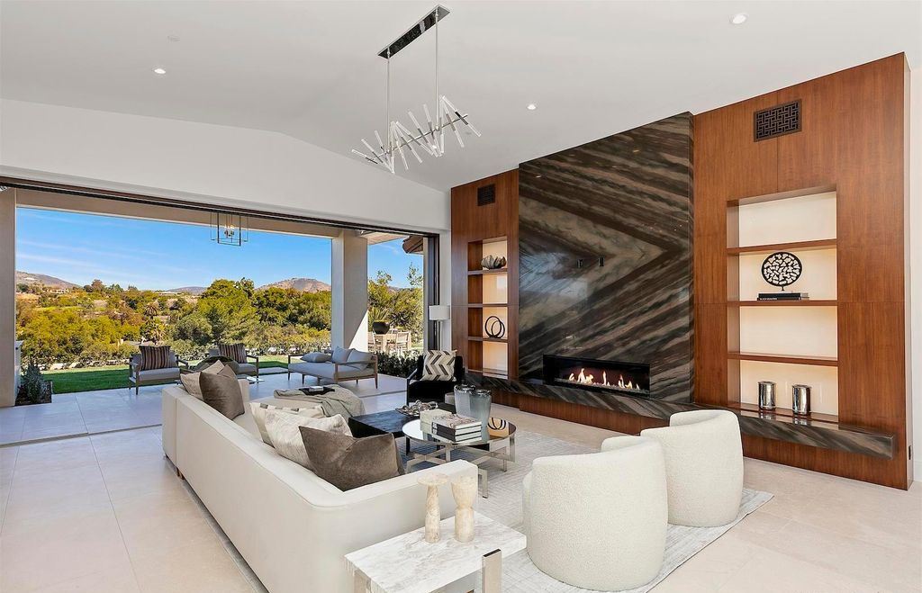 The Home in Rancho Santa Fe is an exquisite luxury oasis conceived by top team builder & design visionaries offering incomparable unobstructed views now available for sale. This house located at 18080 Via De Fortuna, Rancho Santa Fe, California