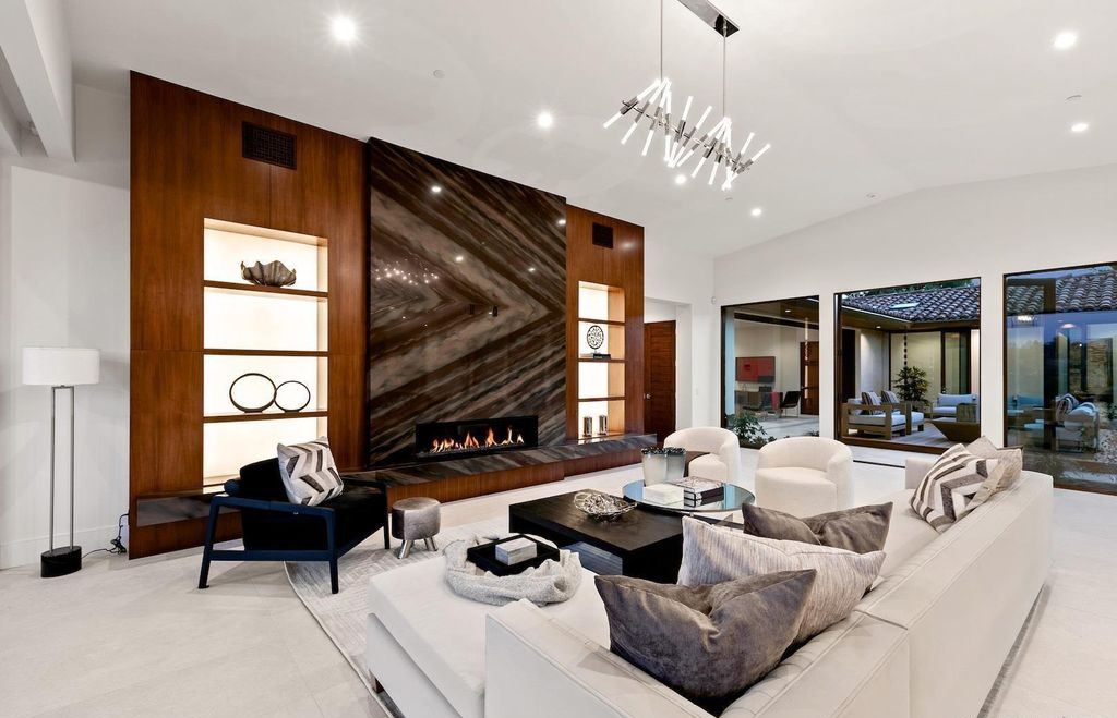 The Home in Rancho Santa Fe is an exquisite luxury oasis conceived by top team builder & design visionaries offering incomparable unobstructed views now available for sale. This house located at 18080 Via De Fortuna, Rancho Santa Fe, California