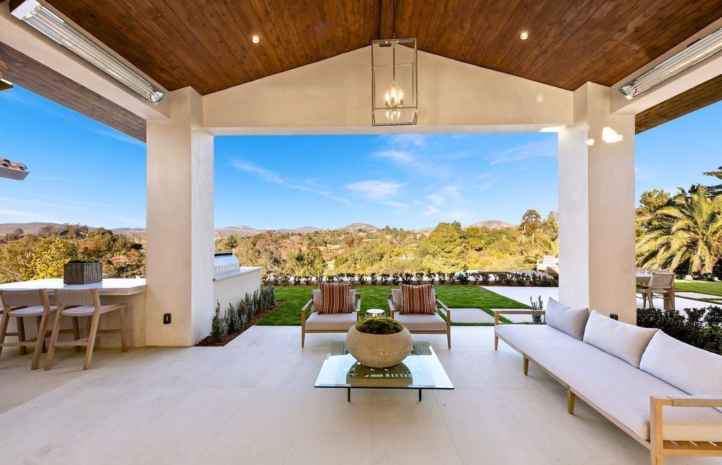 The Home in Rancho Santa Fe is an exquisite luxury oasis conceived by top team builder & design visionaries offering incomparable unobstructed views now available for sale. This house located at 18080 Via De Fortuna, Rancho Santa Fe, California