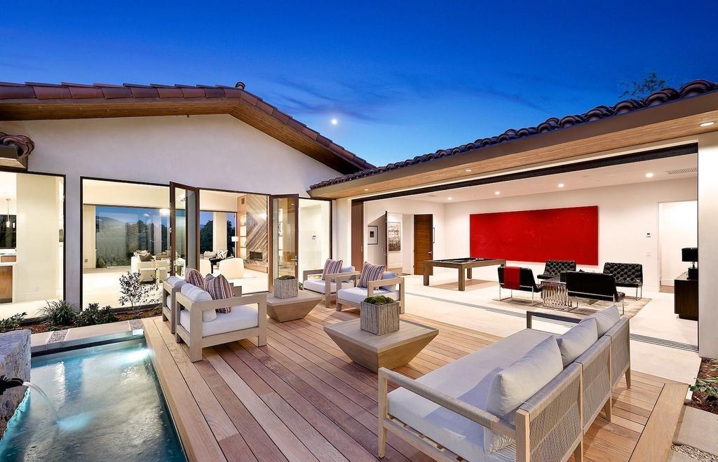 The Home in Rancho Santa Fe is an exquisite luxury oasis conceived by top team builder & design visionaries offering incomparable unobstructed views now available for sale. This house located at 18080 Via De Fortuna, Rancho Santa Fe, California