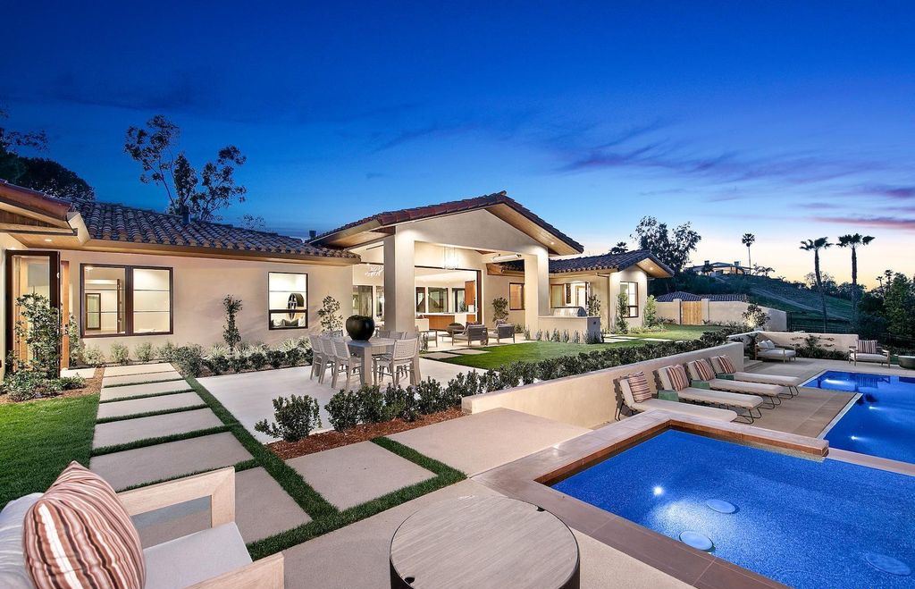 The Home in Rancho Santa Fe is an exquisite luxury oasis conceived by top team builder & design visionaries offering incomparable unobstructed views now available for sale. This house located at 18080 Via De Fortuna, Rancho Santa Fe, California