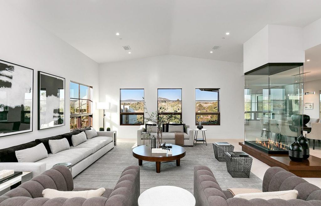 The Home in Rancho Santa Fe is an exquisite luxury oasis conceived by top team builder & design visionaries offering incomparable unobstructed views now available for sale. This house located at 18080 Via De Fortuna, Rancho Santa Fe, California