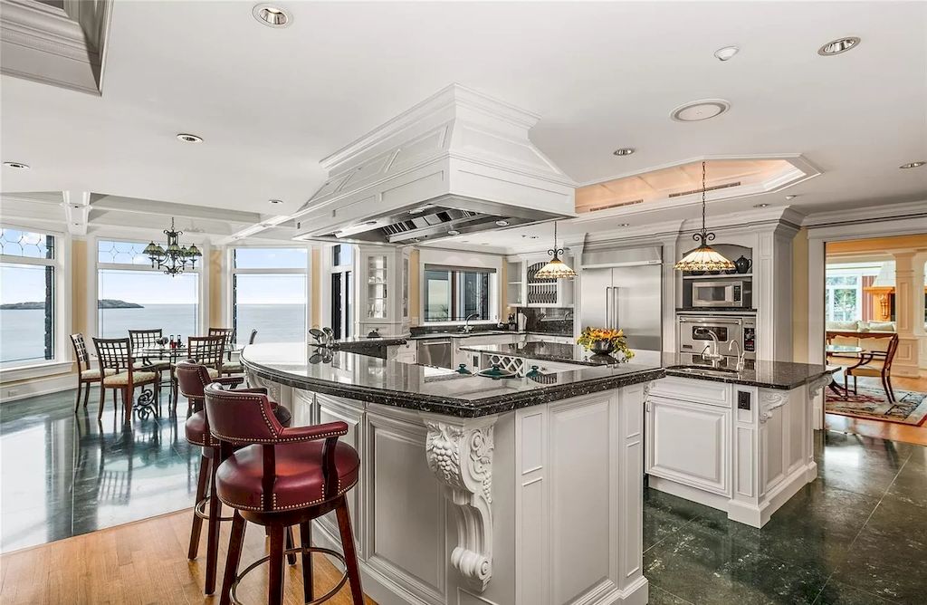 The House in Oak Bay is entertainment haven complete with resort style living with a pool, hot tub, expansive patio sections including covered sections & oceanfront setting with beach access now available for sale