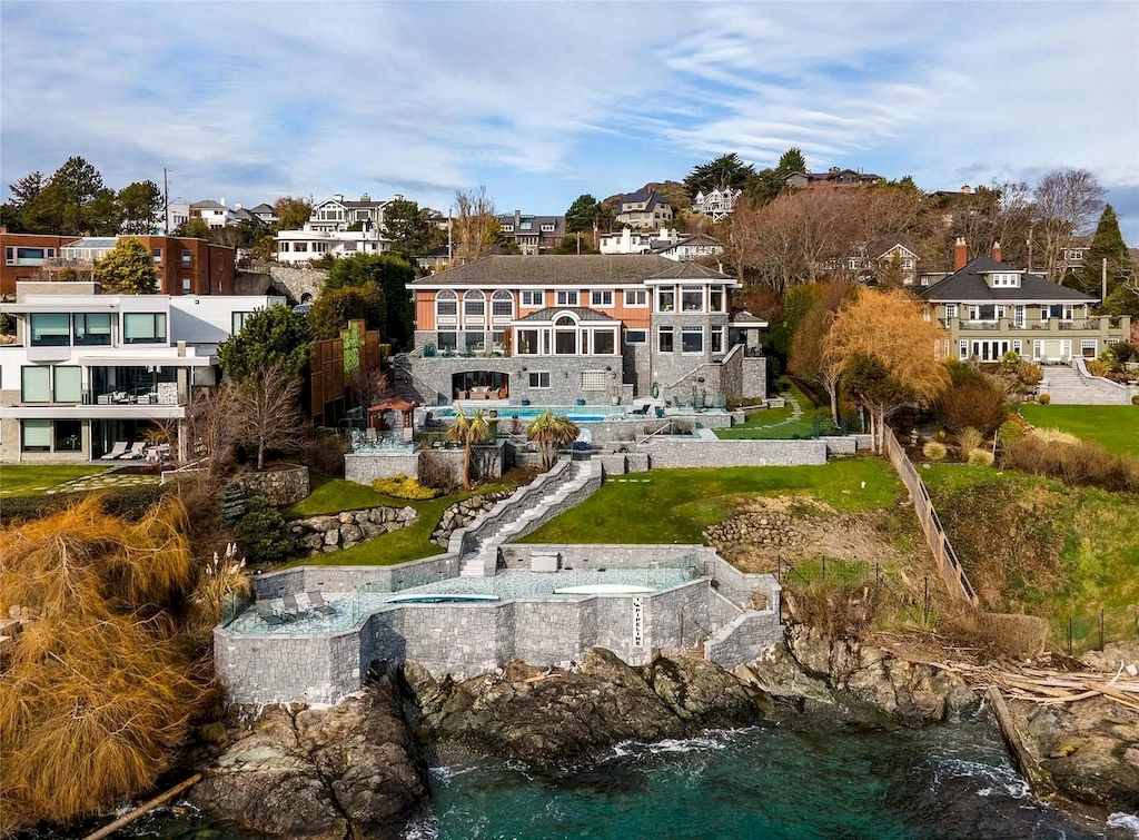 The House in Oak Bay is entertainment haven complete with resort style living with a pool, hot tub, expansive patio sections including covered sections & oceanfront setting with beach access now available for sale