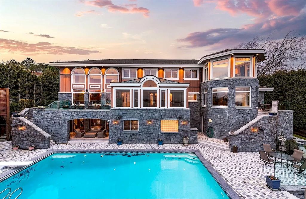 The House in Oak Bay is entertainment haven complete with resort style living with a pool, hot tub, expansive patio sections including covered sections & oceanfront setting with beach access now available for sale
