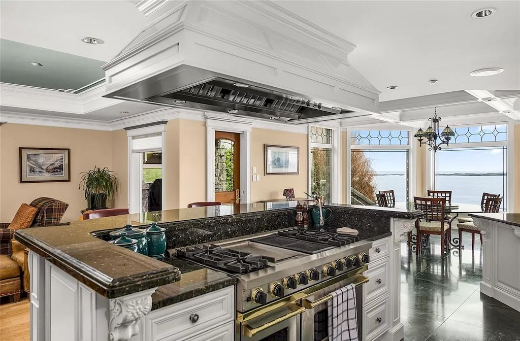 The House in Oak Bay is entertainment haven complete with resort style living with a pool, hot tub, expansive patio sections including covered sections & oceanfront setting with beach access now available for sale