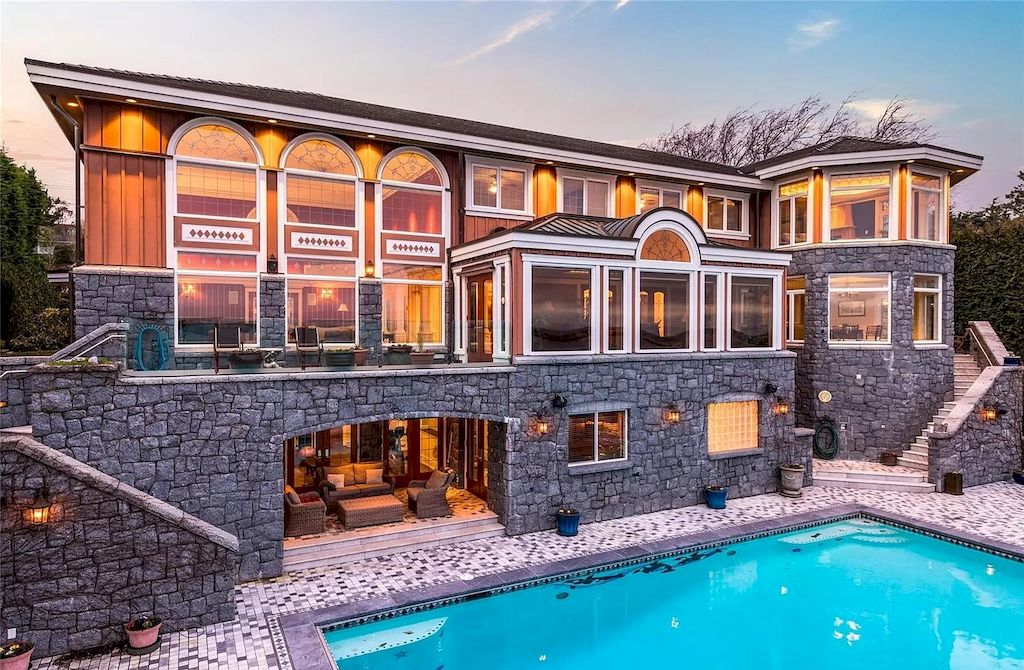 The House in Oak Bay is entertainment haven complete with resort style living with a pool, hot tub, expansive patio sections including covered sections & oceanfront setting with beach access now available for sale