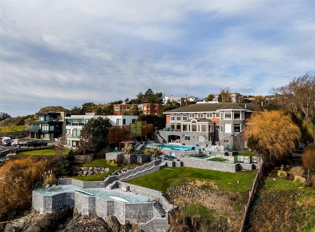 The House in Oak Bay is entertainment haven complete with resort style living with a pool, hot tub, expansive patio sections including covered sections & oceanfront setting with beach access now available for sale