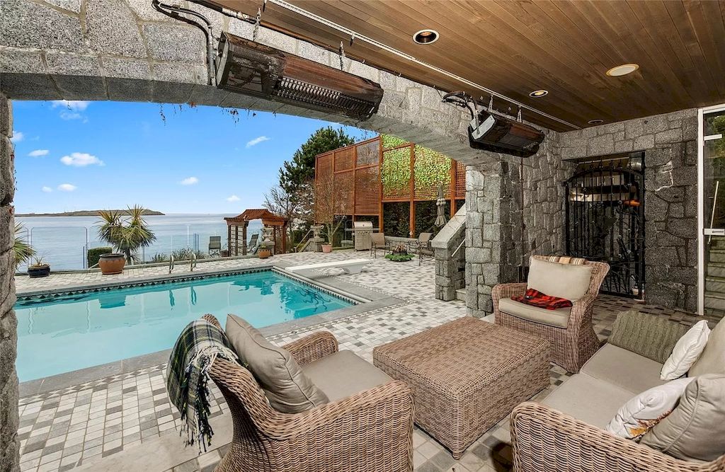 The House in Oak Bay is entertainment haven complete with resort style living with a pool, hot tub, expansive patio sections including covered sections & oceanfront setting with beach access now available for sale