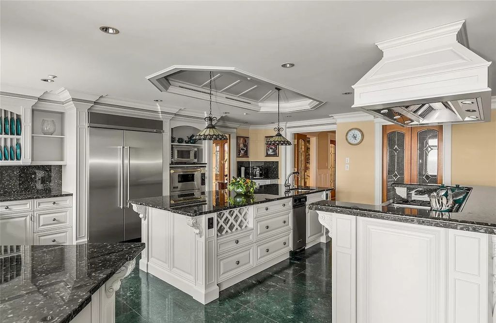 The House in Oak Bay is entertainment haven complete with resort style living with a pool, hot tub, expansive patio sections including covered sections & oceanfront setting with beach access now available for sale