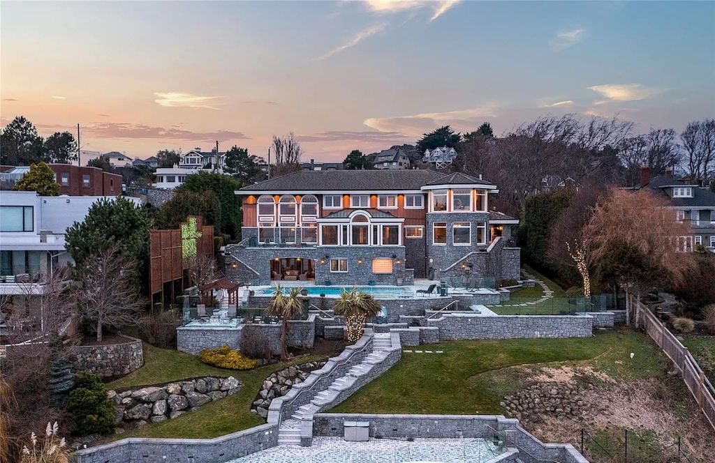 The House in Oak Bay is entertainment haven complete with resort style living with a pool, hot tub, expansive patio sections including covered sections & oceanfront setting with beach access now available for sale