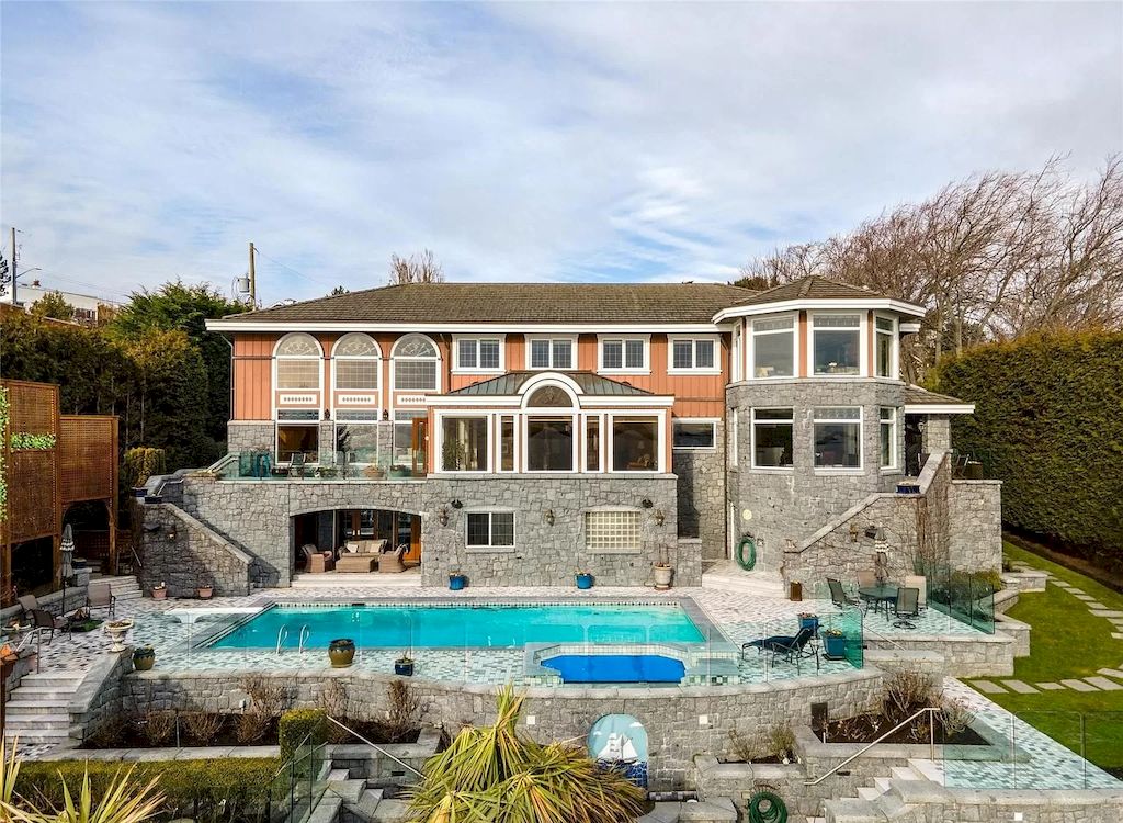 The House in Oak Bay is entertainment haven complete with resort style living with a pool, hot tub, expansive patio sections including covered sections & oceanfront setting with beach access now available for sale