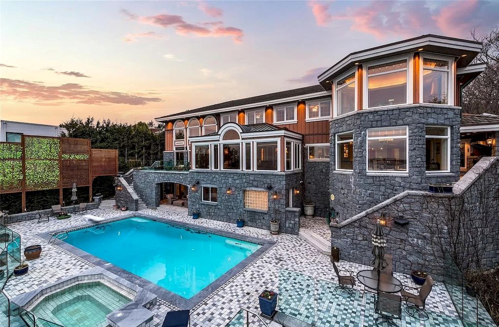 The House in Oak Bay is entertainment haven complete with resort style living with a pool, hot tub, expansive patio sections including covered sections & oceanfront setting with beach access now available for sale