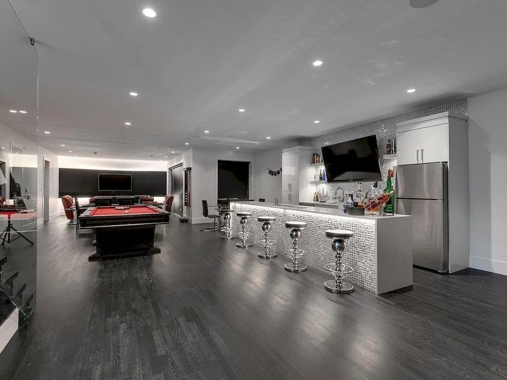 The Mansion in Surrey features beautiful outdoor entertainment area landscaped with high-quality turf, a south-east facing outdoor pool, mini-golf area available for sale